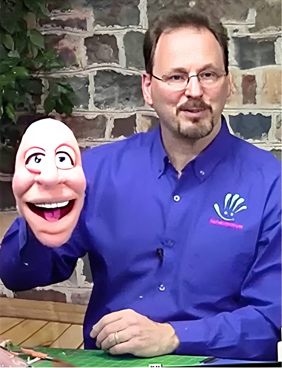 Person with puppet in hand